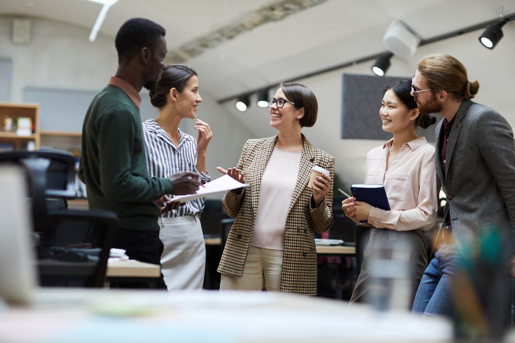 employees talking in an office