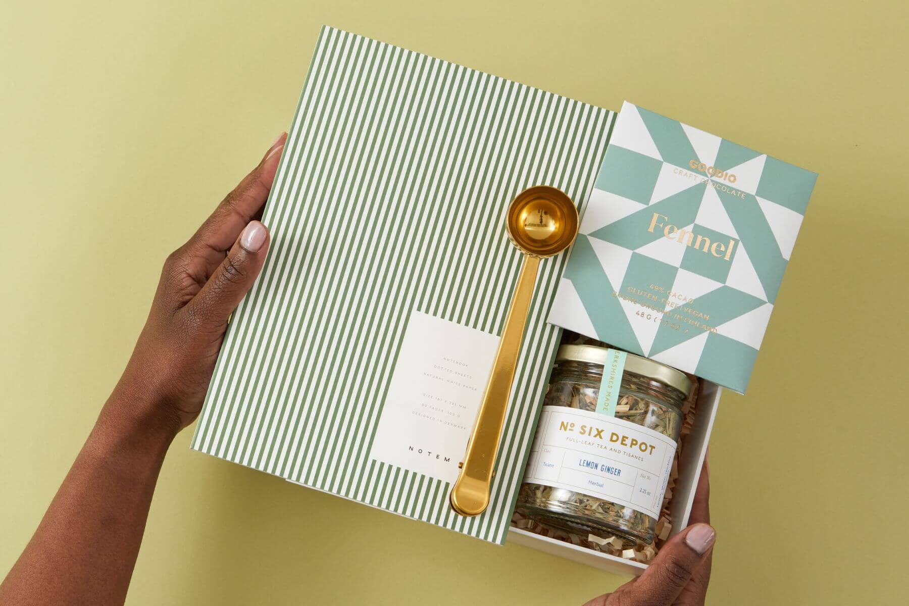 Corporate Gifts for Employees example - gift box with notebook, tea, chocolate and spoon