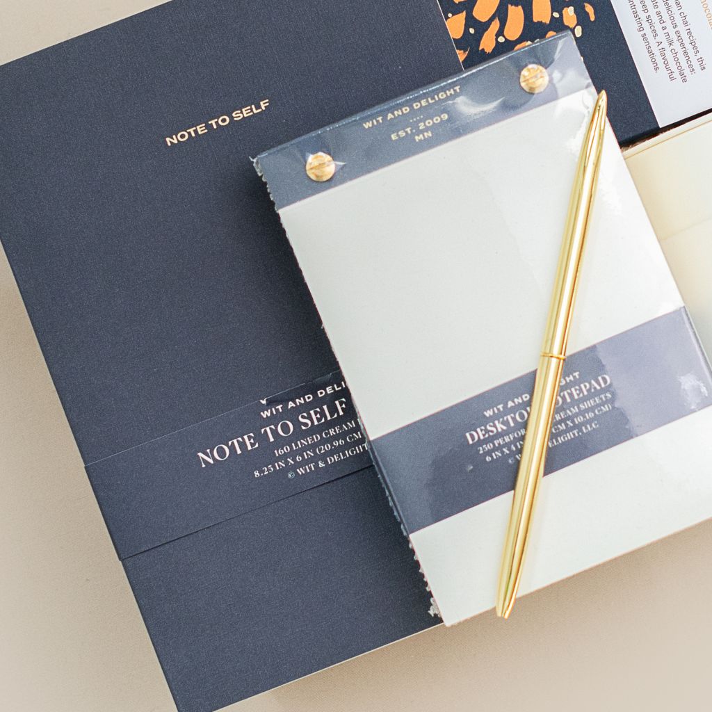 notebook, pen and chocolate bar in a gift box