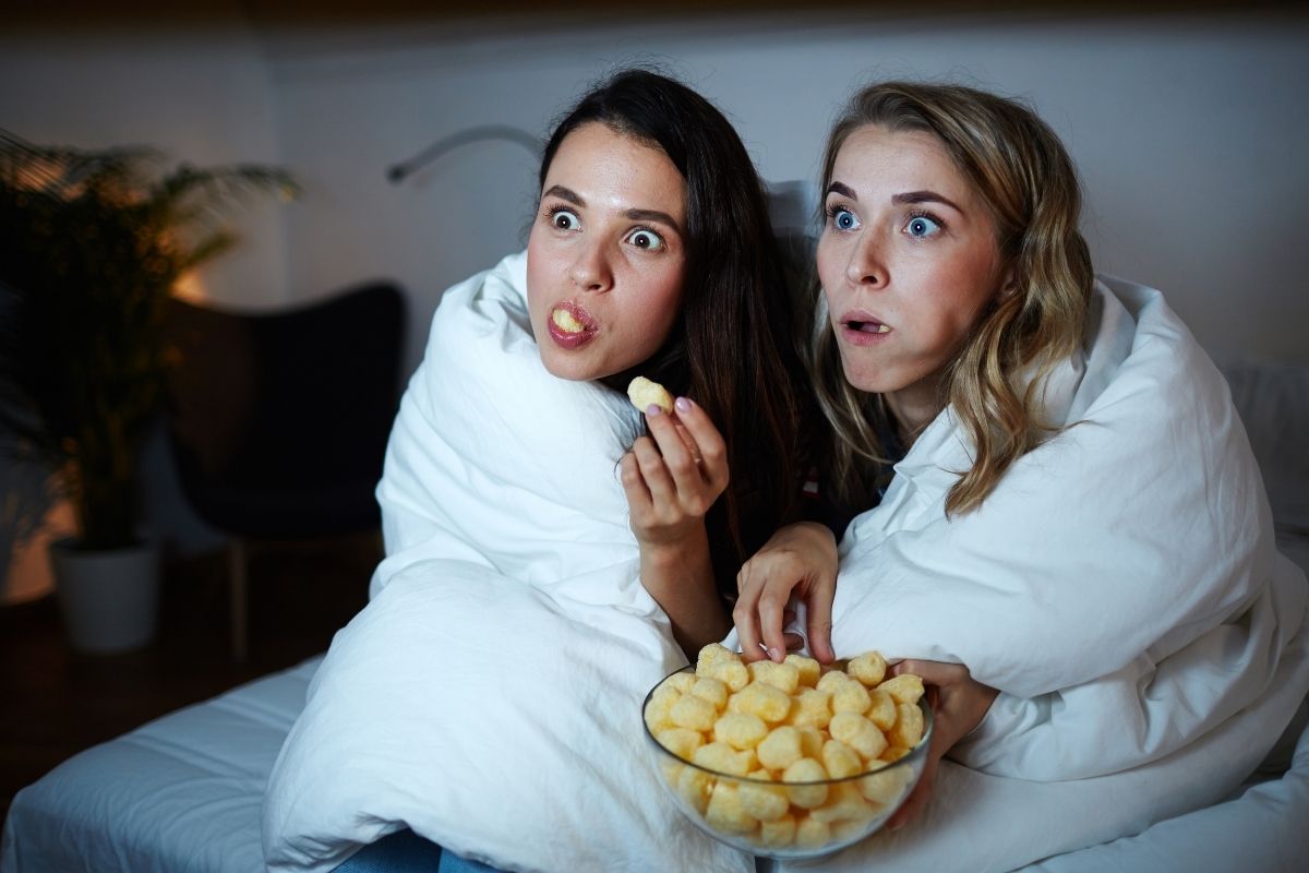 teenage girls watching a movie