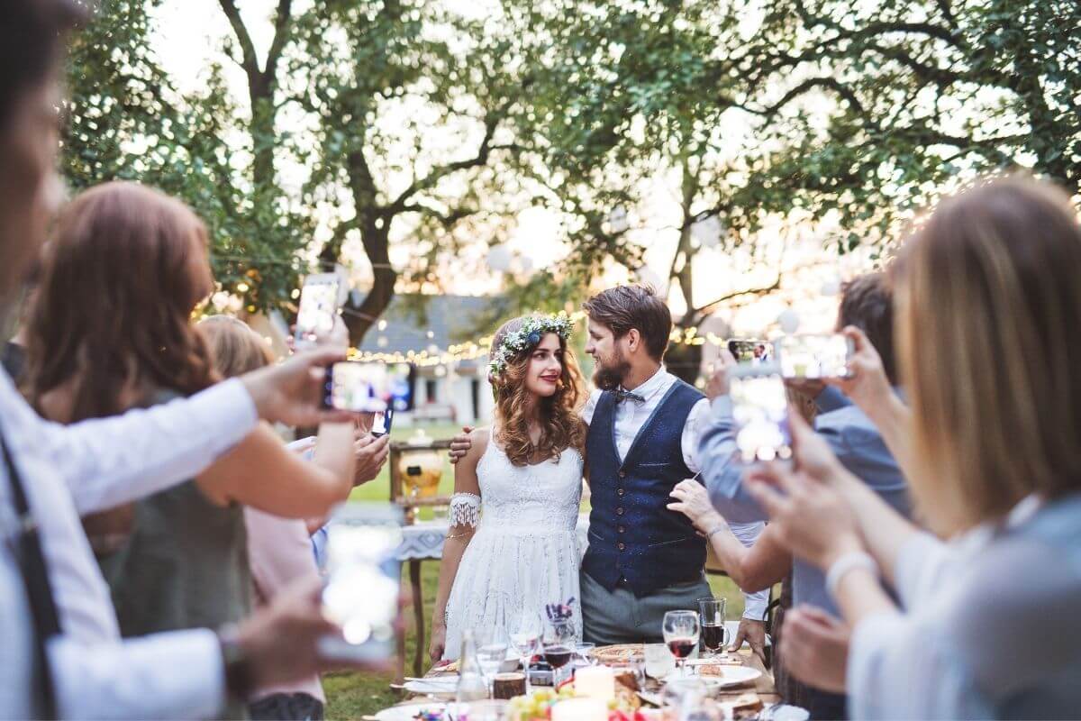 couple having a small backyard wedding reception