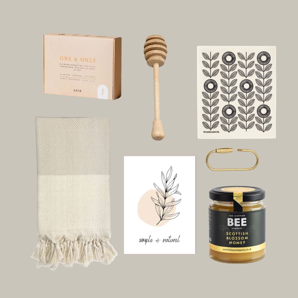Collection of home and kitchen items including a honey dipper, towel, and honey jar on a neutral background.