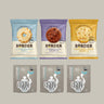 Three packages of Border cookies and three packages of Clipper tea on a gray background