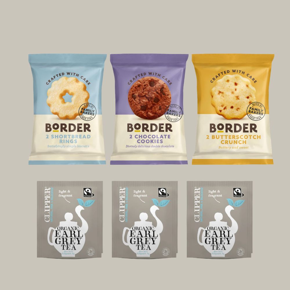 Three packages of Border cookies and three packages of Clipper tea on a gray background